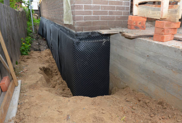 Happy homeowners after waterproofing job in Hood